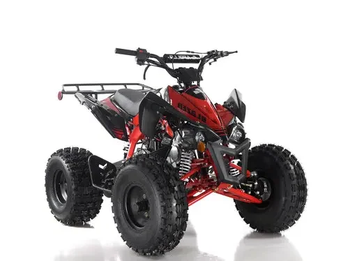 A red and black atv is parked on the ground
