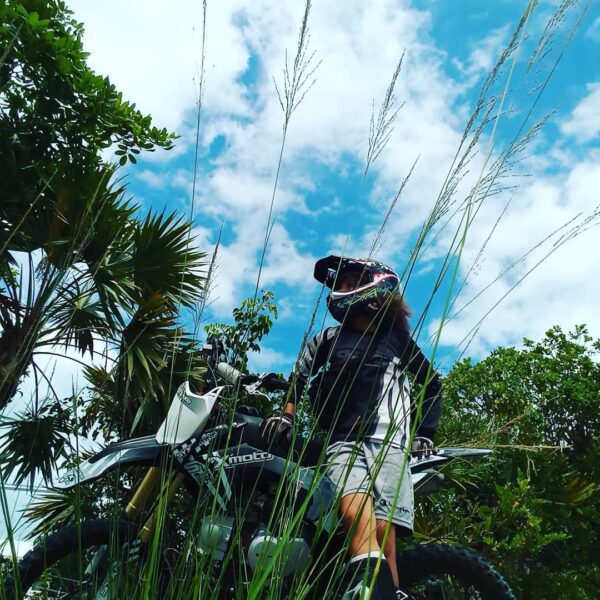 Rider standing beside the SYX Moto 125cc Dirt Bike