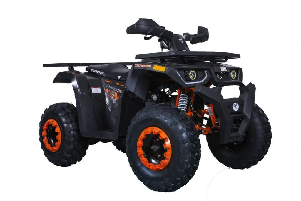 A black and orange atv with an extended rack.