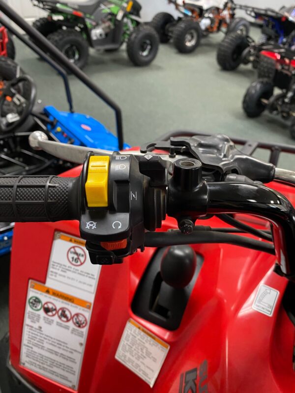 A close up of the handle bars on an atv.