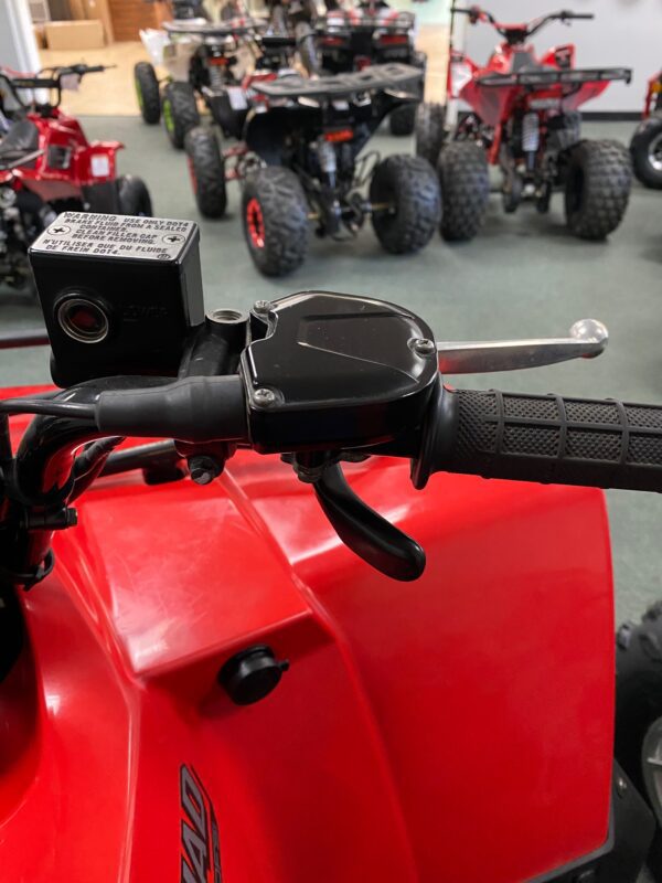 A close up of the handle bars on an atv.