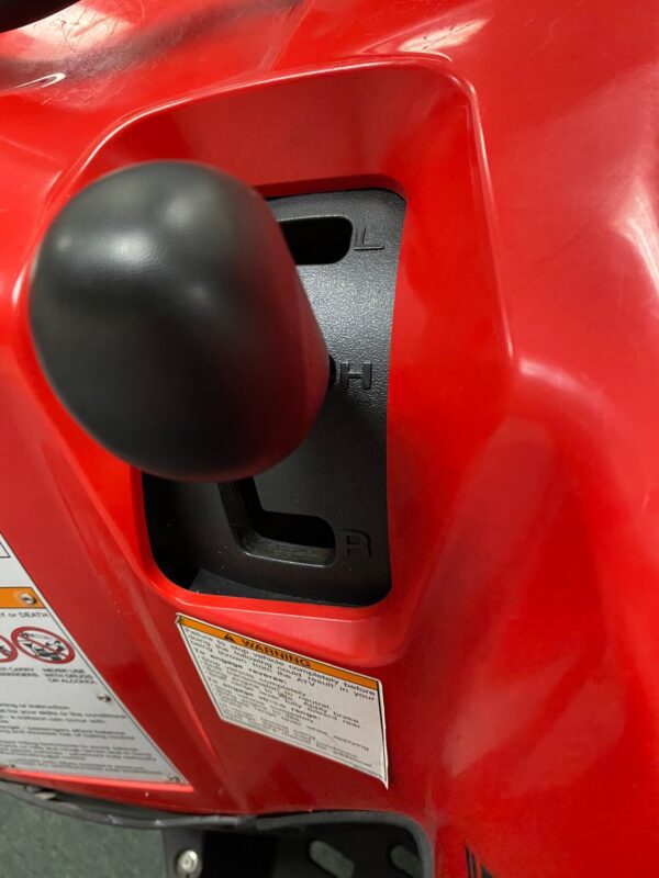 A close up of the gas tank on a red motorcycle