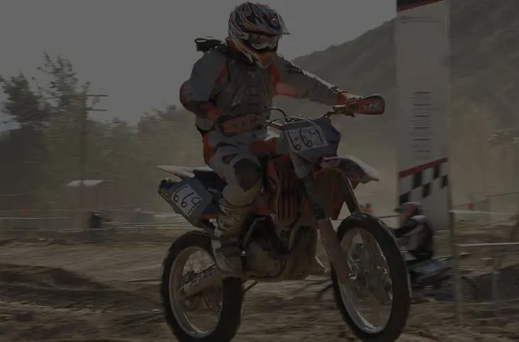 A person on a dirt bike in the air.