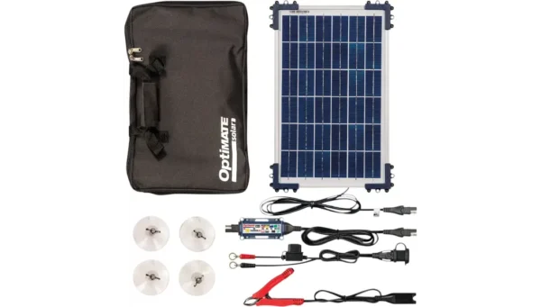 A solar panel and charger with its contents laid out.