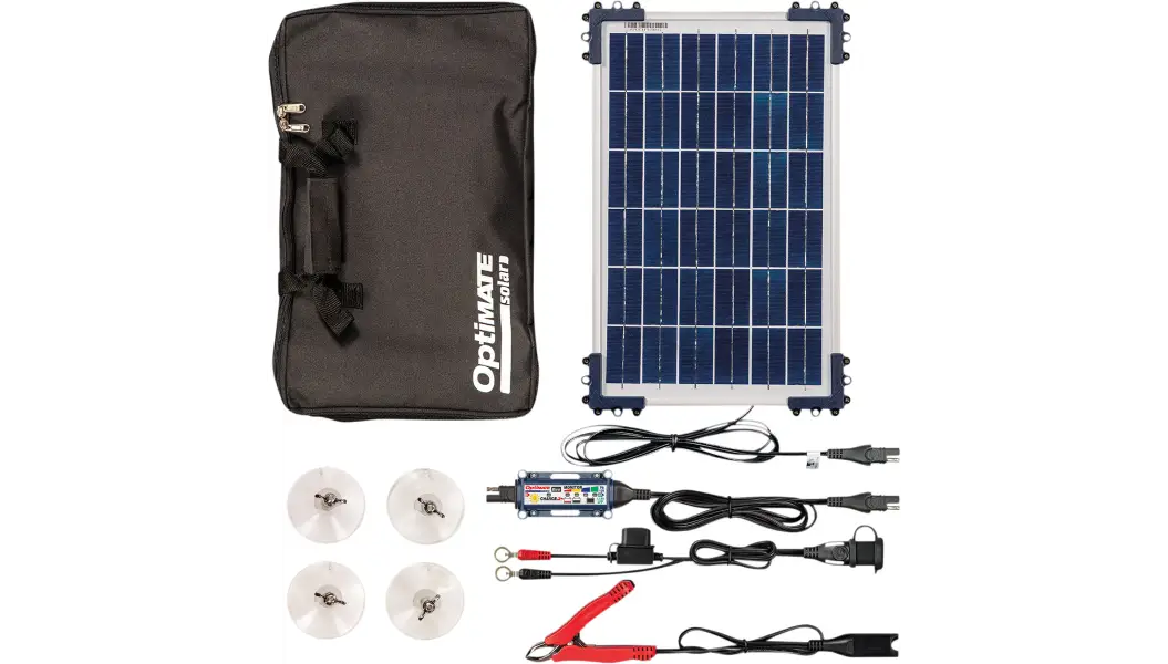 A solar panel and charger with its contents laid out.