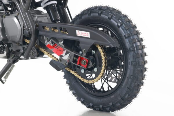 A close up of the rear wheel on a dirt bike