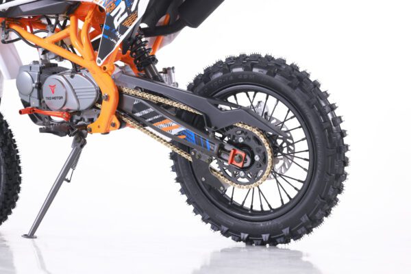 A close up of the front wheel on a dirt bike.