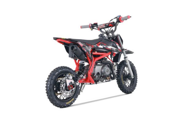 A red and black dirt bike is parked on the ground