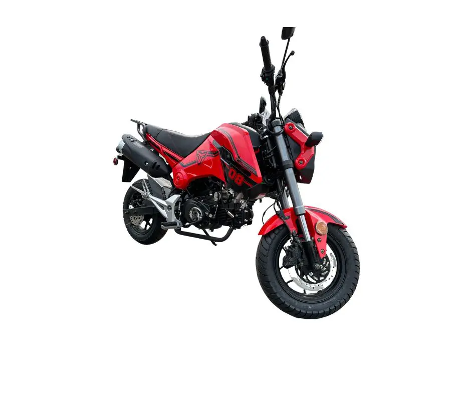 A red motorcycle is parked on the ground.