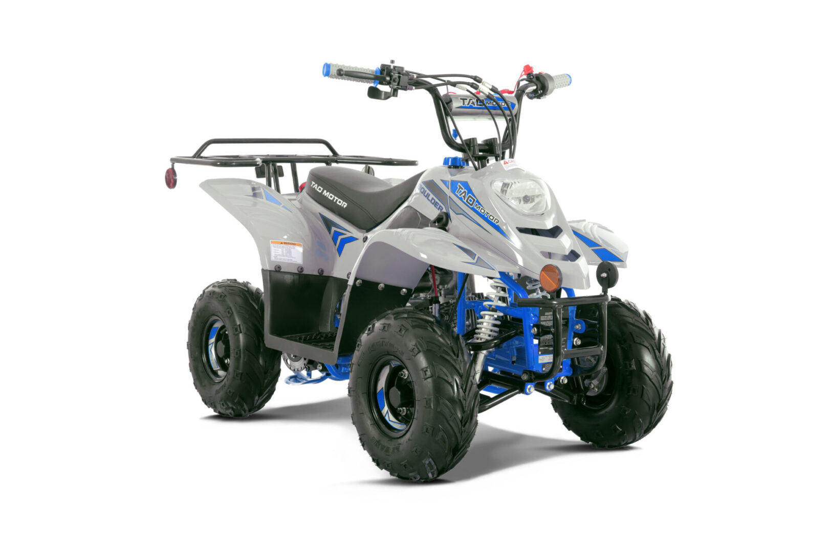 A white and blue atv is parked on the ground