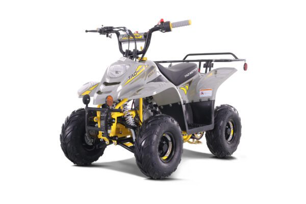 A yellow and silver atv is parked in the sun.